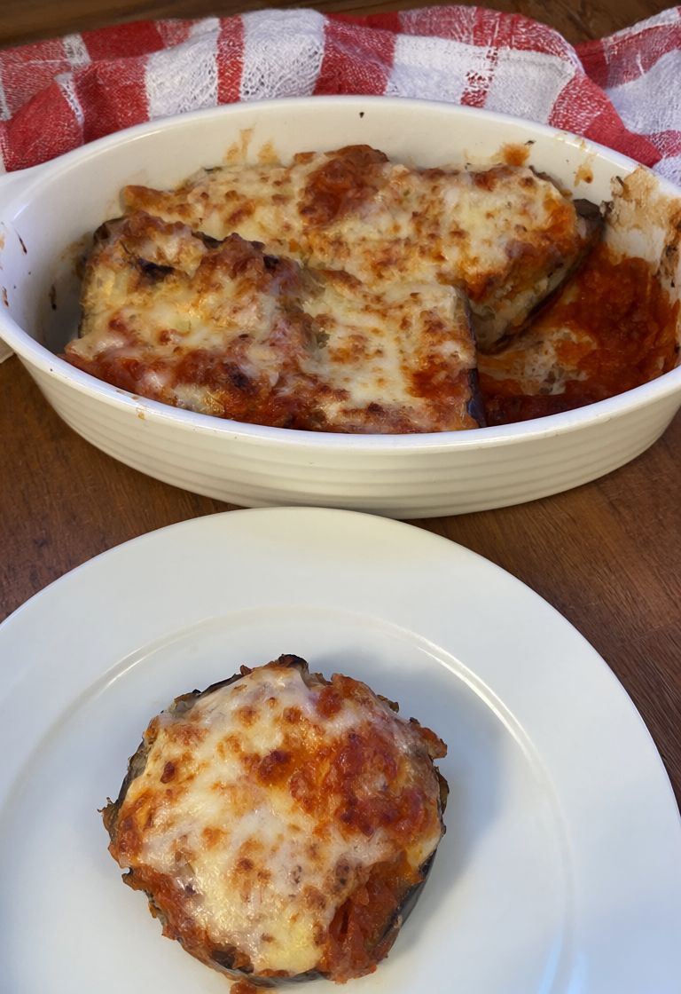 Baked eggplant layered with tomato sauce and mozzarella